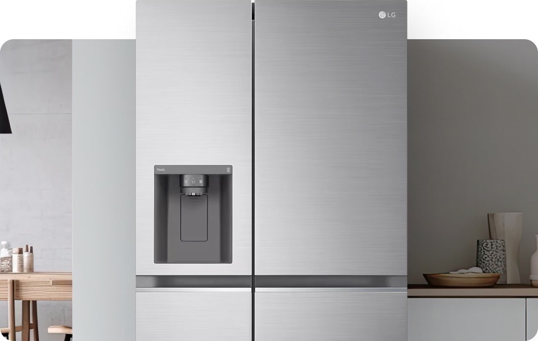 Close-up of an LG American-style fridge freezer in a silver finish, seamlessly integrated into a bright modern kitchen, highlighting a sleek water and ice dispenser.