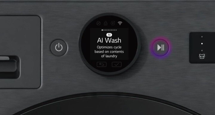 Zooming out from the LG washing machine control panel showing AI Wash mode. Inside the drum, the AI DD chip senses a pink sweatshirt to optimise the wash.