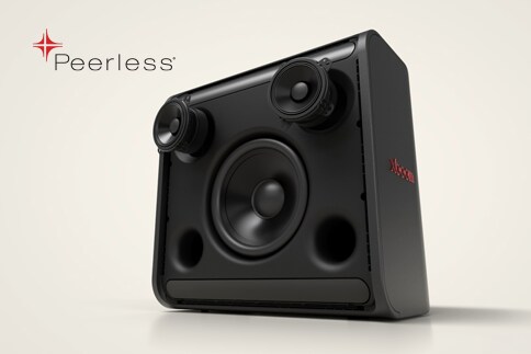 Woman sits indoors relaxing with LG Speaker