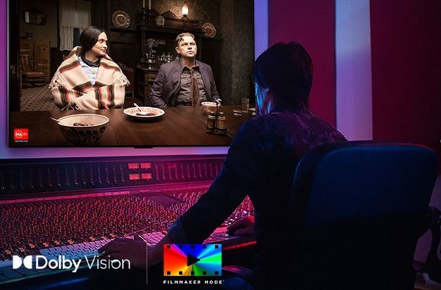 A director in front of a control panel editing the movie "Killers of the Flower Moon" on an LG OLED TV. In the bottom left, the Dolby Vision logo and FILMMAKER MODE logo.