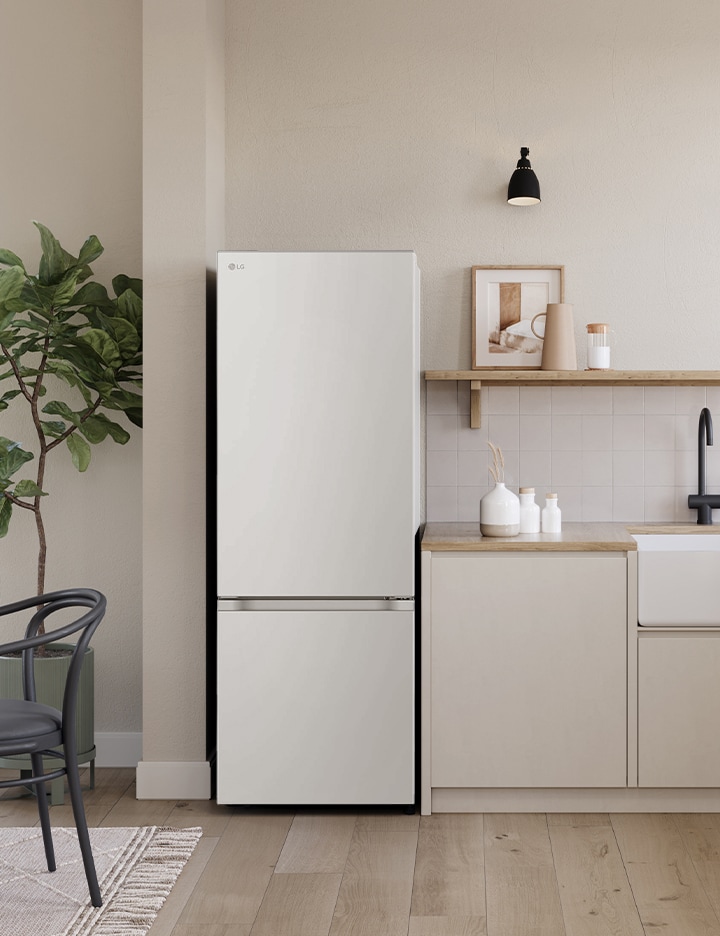 Overall view of the kitchen with lg bottom freezer refrigerator installed beside the countertop.	