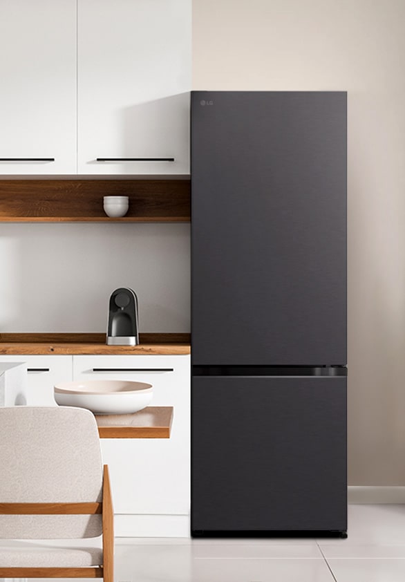 The front view of lg bottom freezer refrigerator in a white modern kitchen room.	