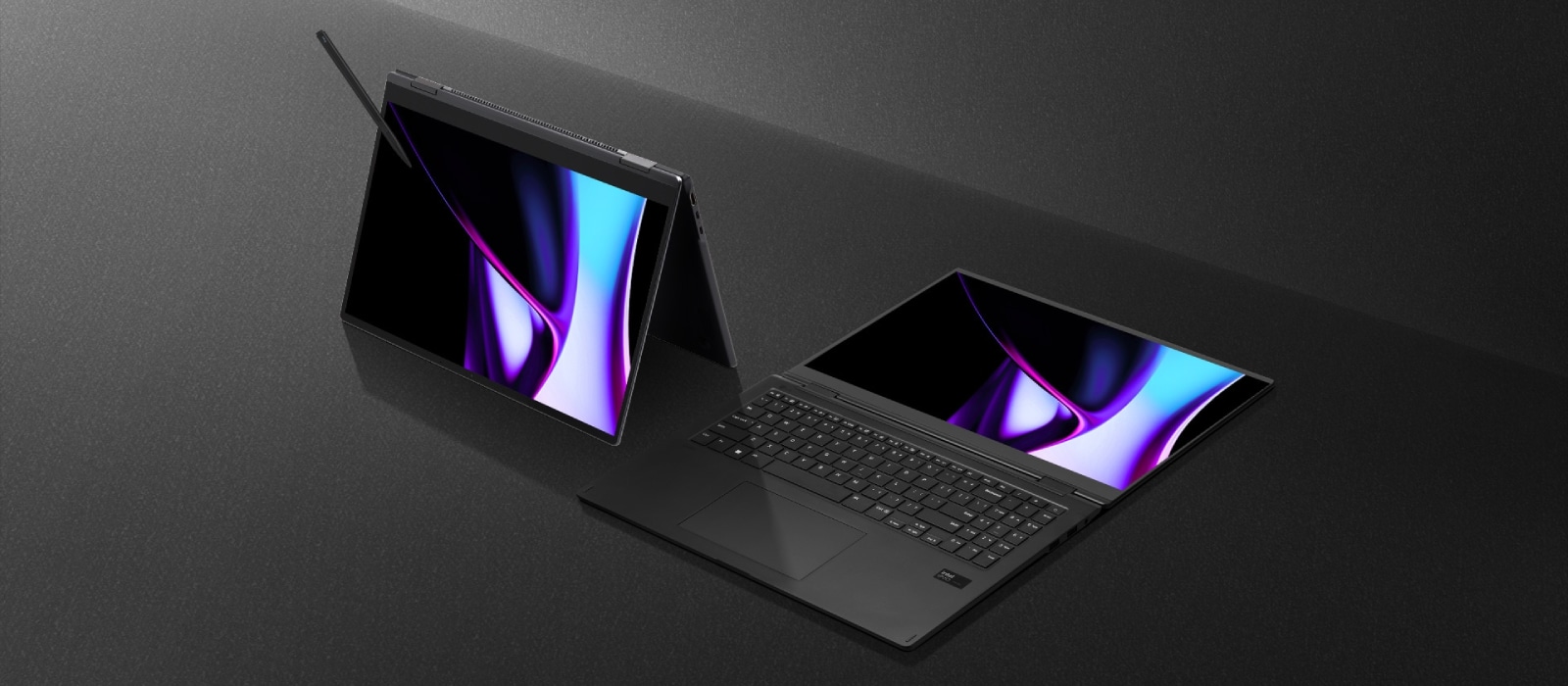 Two LG gram Pro 2in1 Laptops are displayed on a dark surface, one in tent mode with a stylus and the other lying flat, both showing vibrant screens.