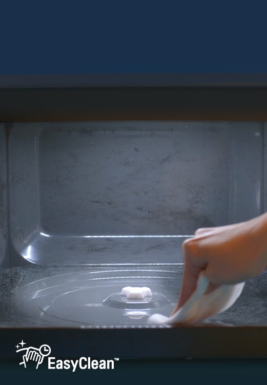 Video showing a hand wiping the inner side of LG Neochef® and food splatter cleaning off easily.