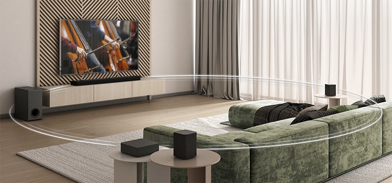 There is TV displays two cellos on the screen, a sound bar, a subwoofer, and 2 rear speakers in a wide living room. A circle graphic connects LG Sound Bar, Sub-woofer, and 2 rear speakers.