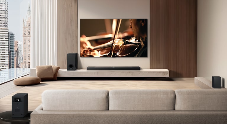 A video shows an LG TV, LG Soundbar, Rear Speakers, and Sub Woofer from behind the sofa in a modern city apartment. The Rear Speakers and Wireless Receiver light up, and a grid overlay appears over the image like a scan of the space. White beads of sound come together to make waves, then project from each part of the sound system, perfectly filling the room with sound.