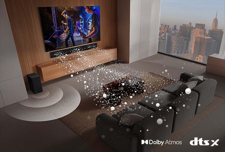 alt="An image of an LG TV and LG Soundbar in a living room playing a musical performance. White soundwaves made up of droplets project from the soundbar, looping around the sofa and living space to depict surround sound. A city skyline is visible through the window.  Dolby Atmos logo DTS X logo"