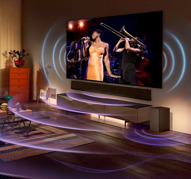 Imagem da TV LG OLED numa sala mostrando um show musical. Linhas curvas azuis, representando o som da TV, e linhas curvas roxas, representando o som da Soundbar, preenchem o espaço.