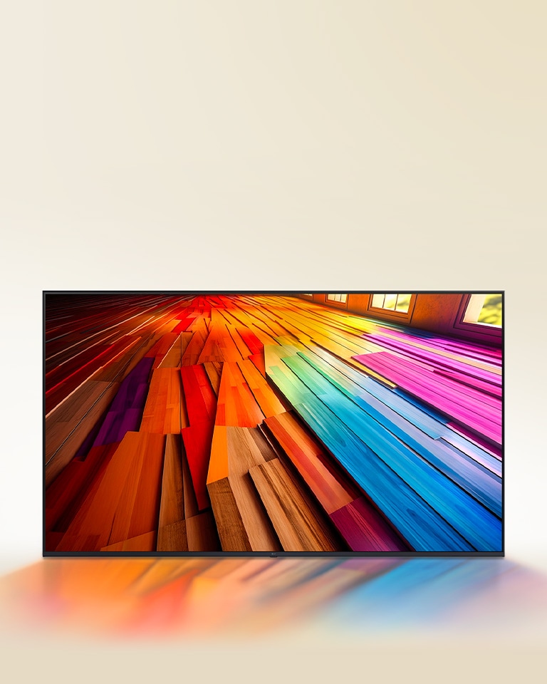 Uma longa extensão de um assoalho de madeira com cores vibrantes é exibido em uma LG UHD TV.