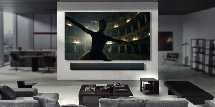 Different living rooms are featured, each with a wall-mounted LG True Wireless TV. In each of these spaces, the setup is neat and tidy. The Zero Connect Box is tucked away under a side table. The content on the screens are rendered in 4K-like definition highlighting the 144Hz video and audio transfer for different content like movies, music, and gaming.