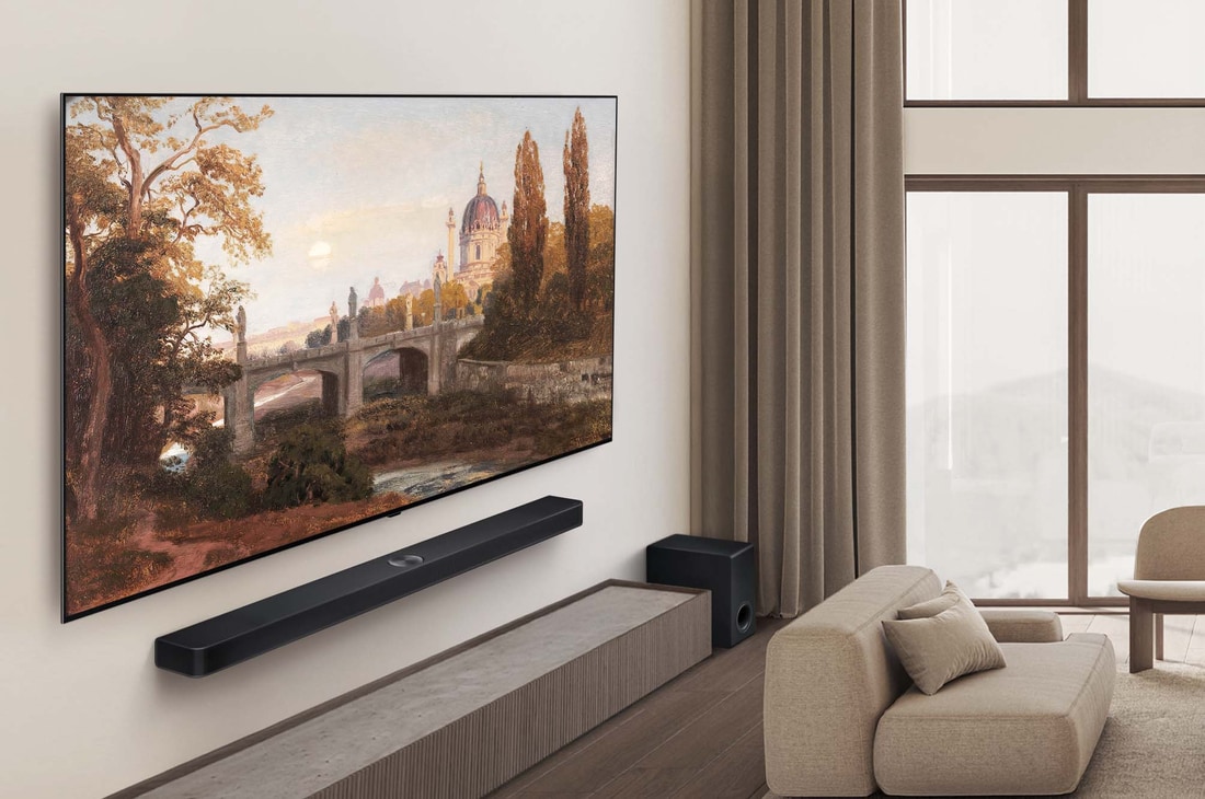 Wide view of a premium living room in muted earth tones. On the wall is an LG OLED AI B5 4K Smart TV with an artwork on its screen. An LG Soundbar is mounted underneath it. 