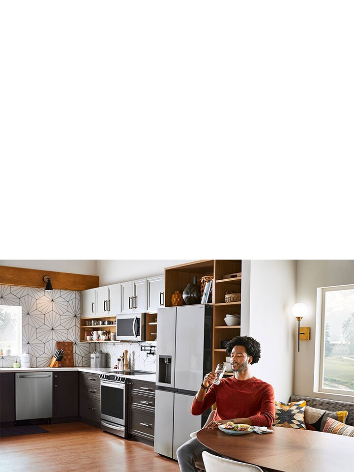 A white piece of cloth is shown in the drum of the washing machine front load washer being washed.	
