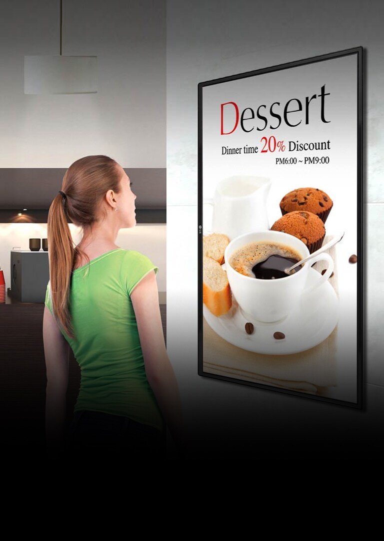 Woman Looking at LG Retail Digital Signage Advertisement