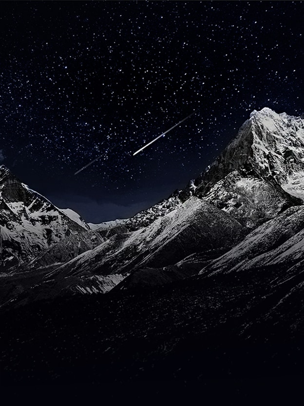 A night view of mountain ranges is split into two halves for comparison: the left side shows washed-out blacks, while the right side demonstrates “Perfect Black” technology with vivid stars and sharp mountain details.