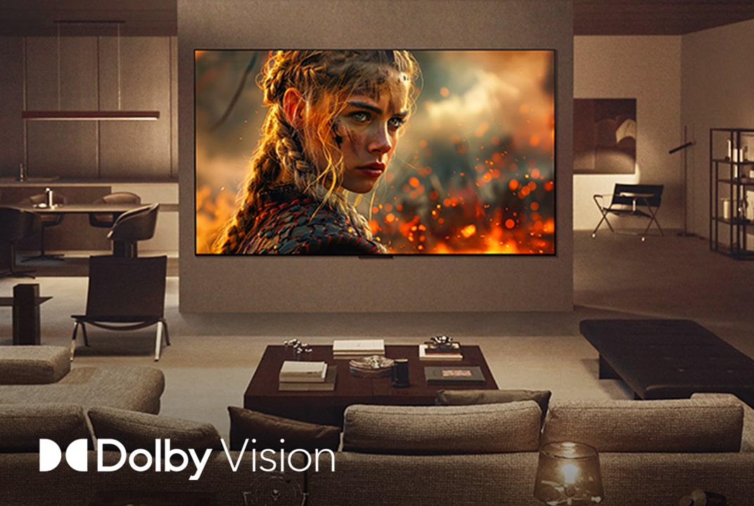 Living room with a wall-mounted LG TV. On the TV is a movie, the colors, clarity, and contrast is incredible. The Dolby Vision logo is also visible.