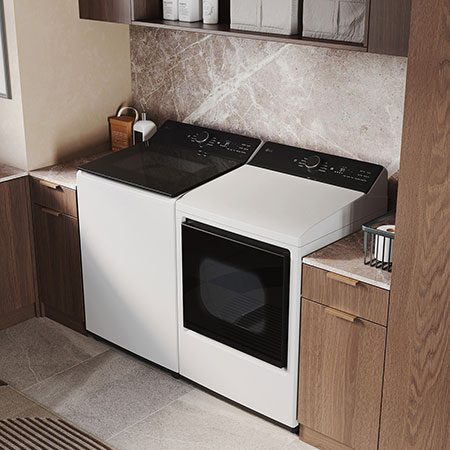The LG Top Load Washer and Dryer set (DLE8400WE) in White, showcasing its premium, side-by-side design seamlessly integrated into a luxurious laundry room with marble and wood finishes.