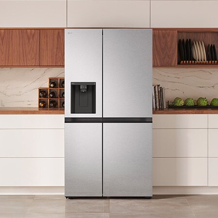 The stainless steel finish LG 36-inch 29 cu.ft. Smart Side-by-Side Refrigerator LS29S3230V with water dispenser, shown installed in a modern kitchen.