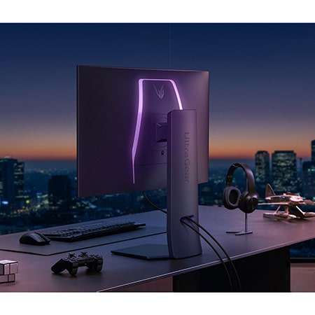 LG UltraGear Gaming Monitor 32GS95UE-B, showcasing the minimalist design and UltraGear lighting against a night cityscape backdrop in a premium gaming setup.