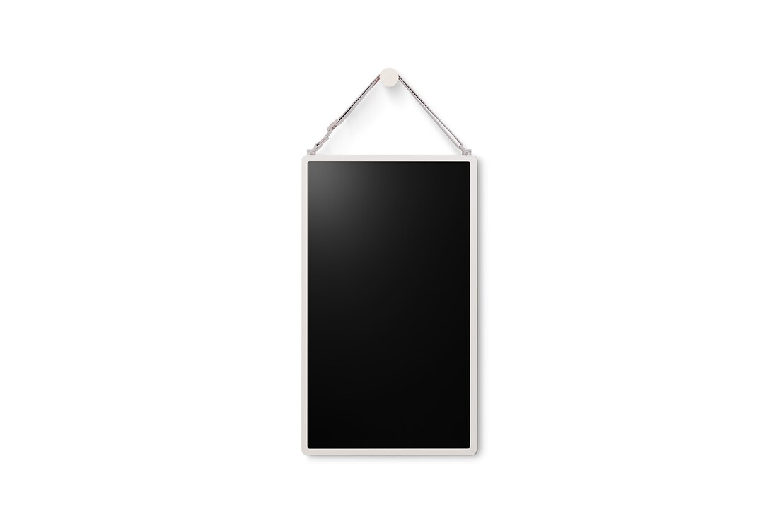 LG StanbyME 2 is hung on the wall using the wall strap.