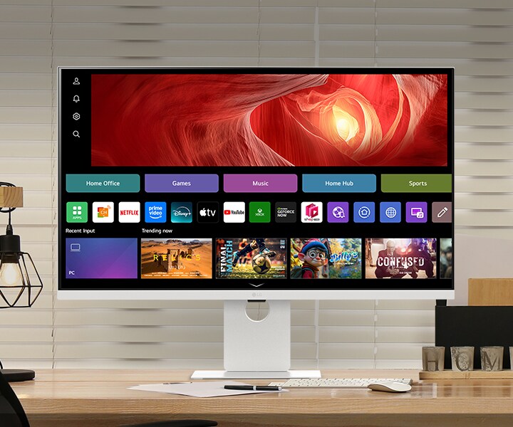 The picture shows a LG Smart Monitor on the desk, featuring work and play.