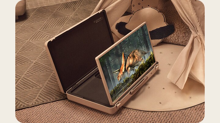LG StanbyME Go case is opened up and the screen propped up in a warmly lit cozy bedroom. 