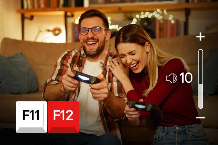 Au-dessus de l’écran du film, les icônes des touches F11 et F12 du clavier sont affichées, et un écran montrant l’augmentation du volume est en cours de lecture.
