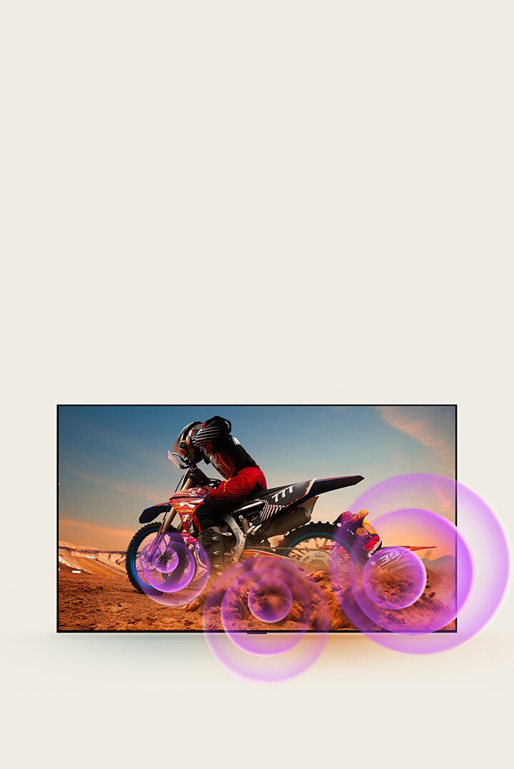 LG OLED TV zobrazuje muže na motocyklu, z jehož kola vycházejí fialové abstraktní kruhy, které vizualizují vyzařování zvuku.