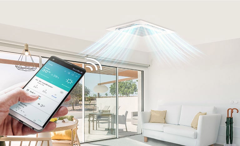 Obrázek osoby ovládající klimatizační jednotku na stropě pomocí smartphonu.