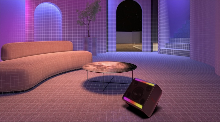 En una habitación con sofá, mesa redonda y planta, el xboom Stage 301 está al frente con su luz encendida.