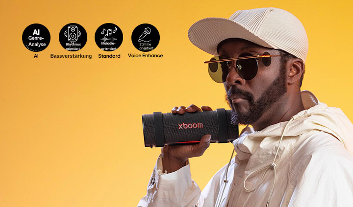 will.i.am hält den xboom Grab direkt neben sein Gesicht. 