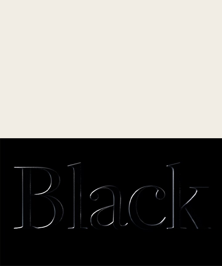 Word black embossed on a black background. 	
