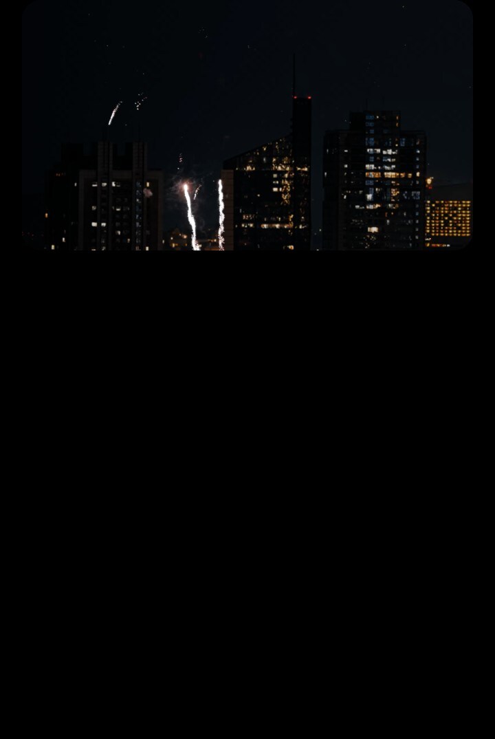 Different scenes showing the surreal visuals when the LG Signature OLED T is in transparent mode. A cityscape with fireworks, a bird picking out something from a small tree, and fishes inside a massive aquarium. Because of the LG Signature OLED T's screen, the scenes look like they're blending with the actual background in reality.