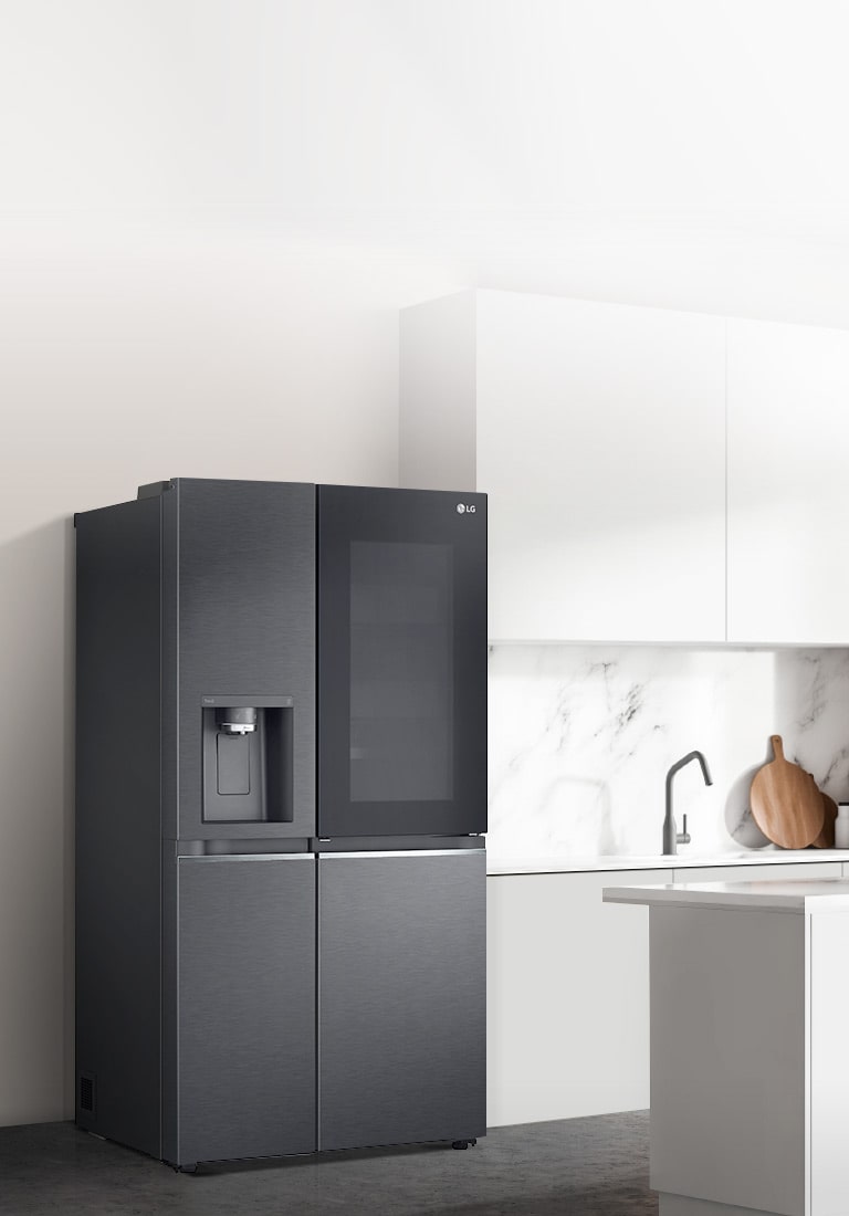 A side view of a kitchen with a black InstaView refrigerator installed.