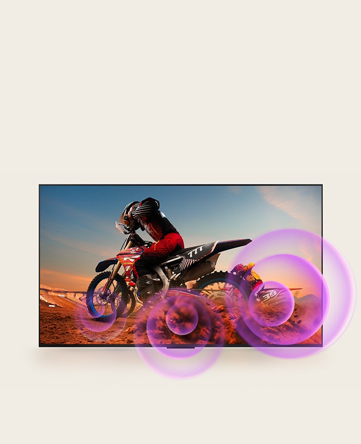 LG QNED TV muestra a un hombre en una motocicleta con círculos abstractos de color morado que salen de la rueda para visualizar la emisión de sonido.	