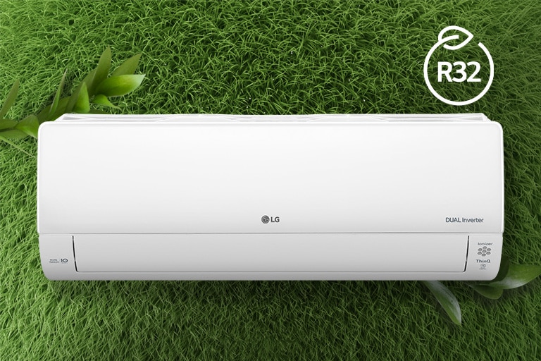 The LG Air conditioner is installed on a wall of grass. The R32 logo for energy efficiency is in the upper right corner.