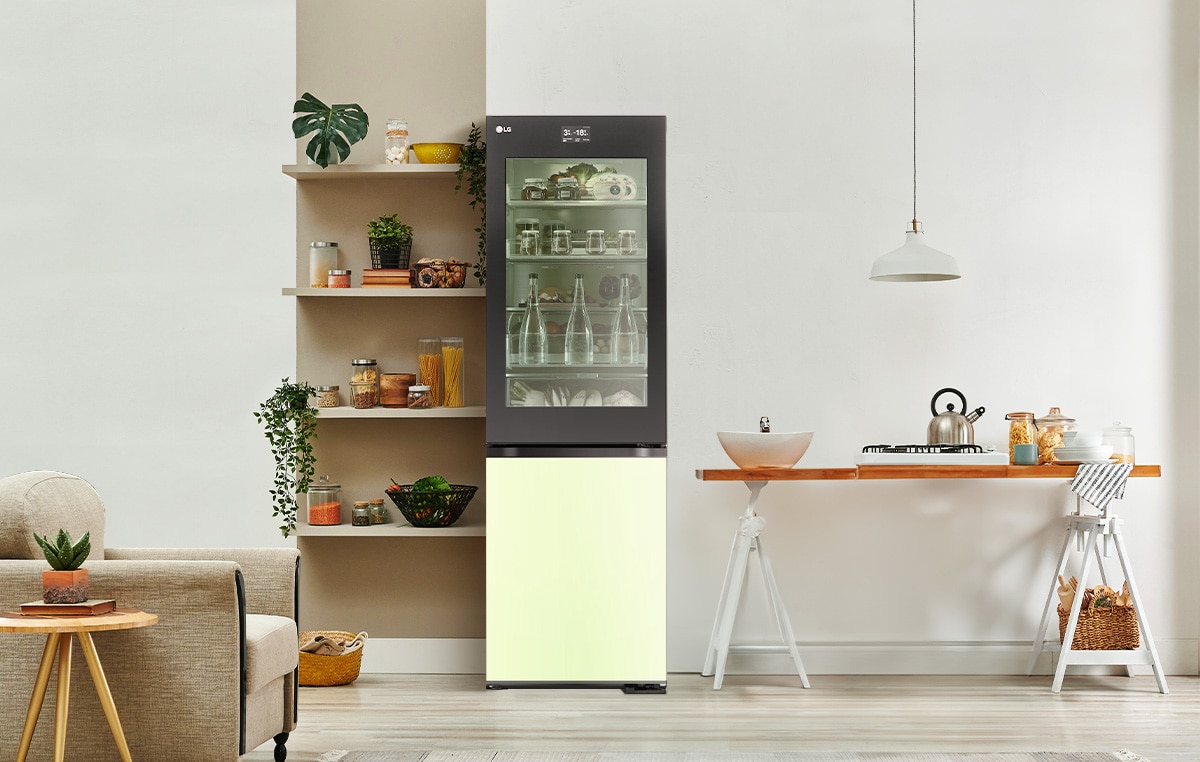 An image of a refrigerator placed in a living room with a cute interior.