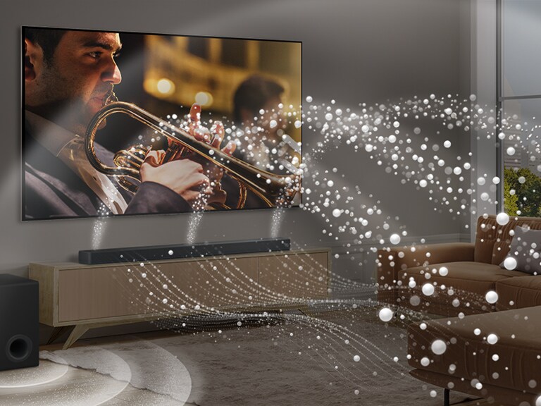 Une barre de son LG, une LG TV et un caisson de basse sont placés dans un appartement urbain moderne. La LG Soundbar émet des ondes sonores composées de gouttelettes blanches emplissant la pièce et un caisson de basse crée un effet sonore à partir du bas. Ensemble, ils créent un effet de dôme dans la pièce.