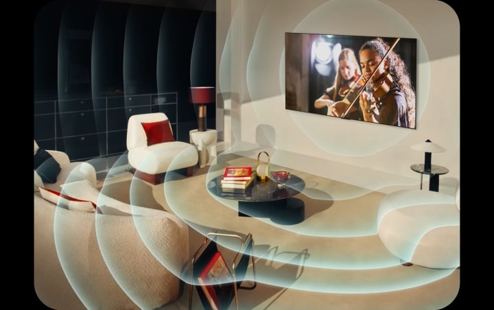 Le TV OLED LG dans un appartement moderne. Une grille apparaît sur l’image comme un scan de l’espace, puis des ondes sonores bleues se projettent depuis l’écran, remplissant toute la pièce de son.