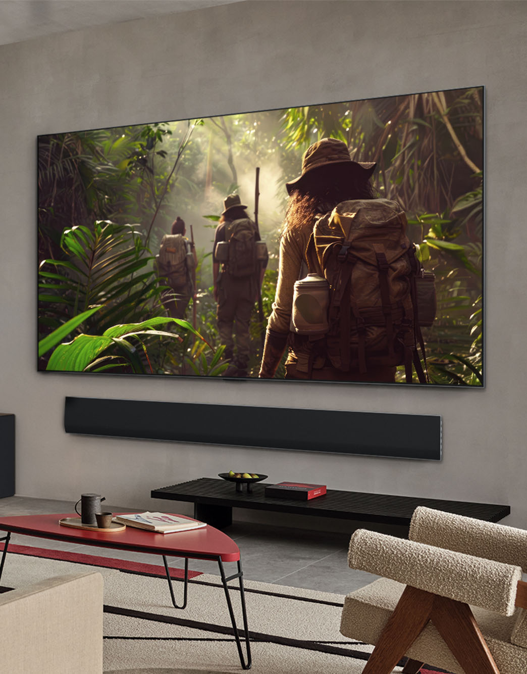Wide view of a living room inside a premium home, a man is watching a movie on his wall-mounted LG OLED TV. The TV's design blends elegantly with the wall and the interior design.