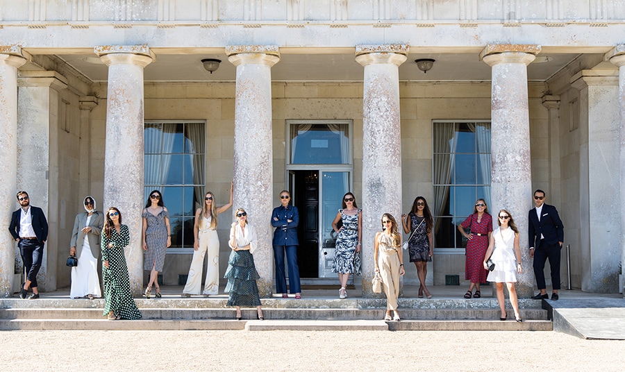 Stylish models try to recreate an iconic photo from the 1800s on the front steps of Goodwood House.