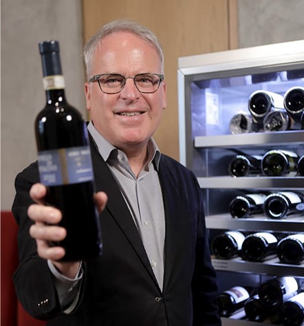 James Suckling recommends a wine  in front of LG SIGNATURE Wine Cellar.