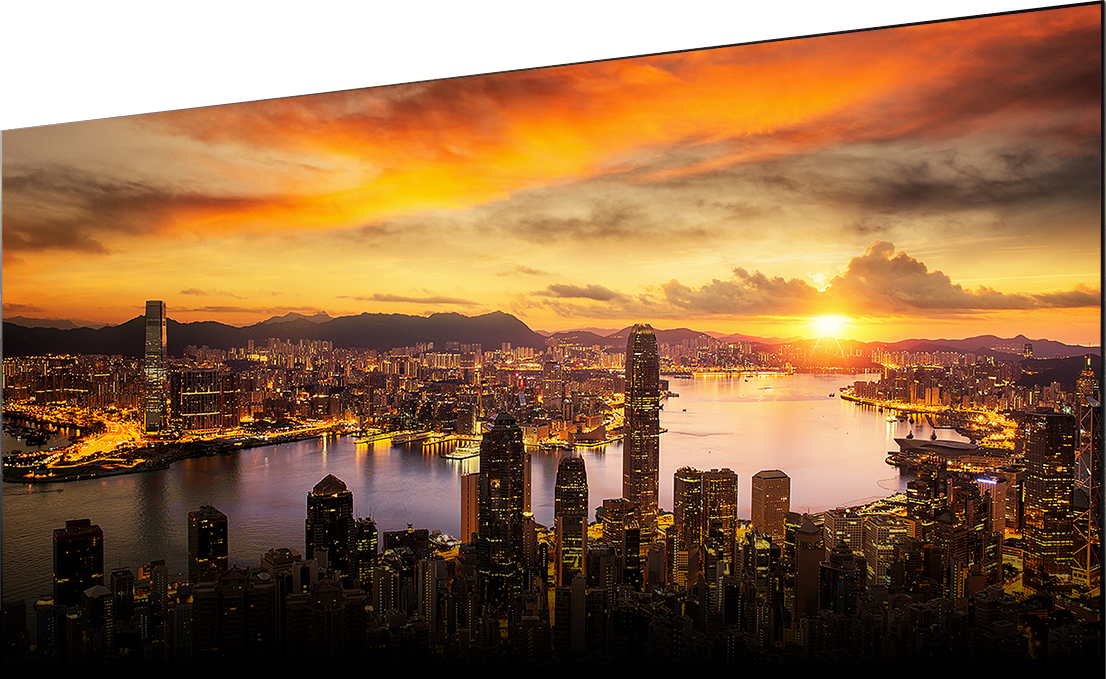 A bird's eye view of a city at sunset with each tiny window in every skyscraper clearly defined.