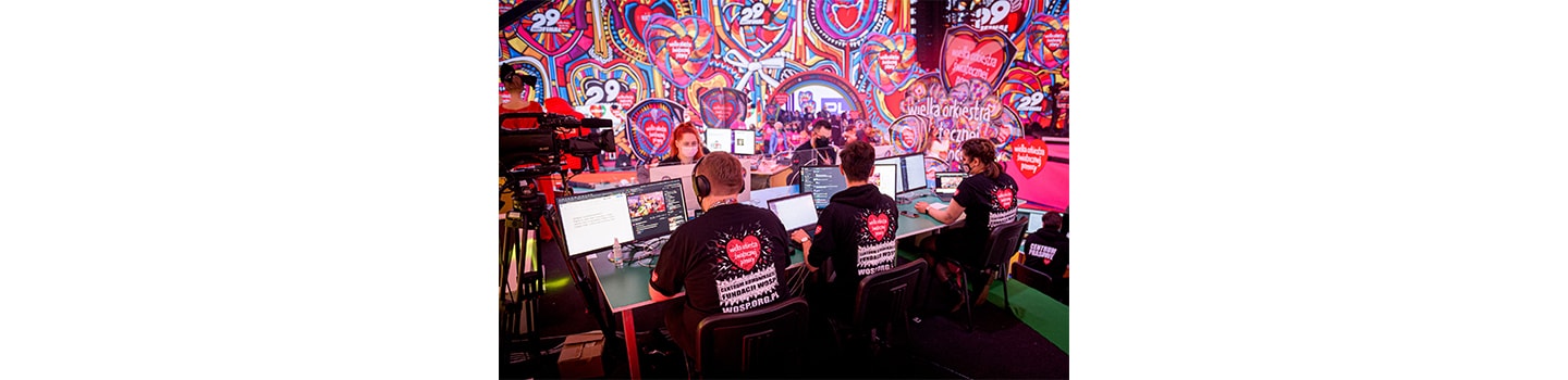Volunteers at the 29th Annual Grand Finale fundraiser using the monitors provided by LG to support the online fundraising.