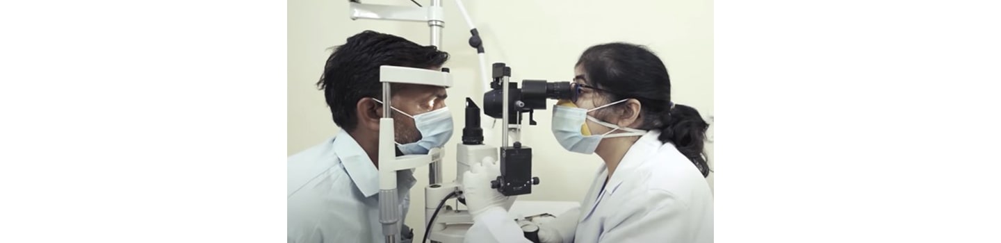 A doctor providing the proper medical care needed by giving a patient a thorough eye exam