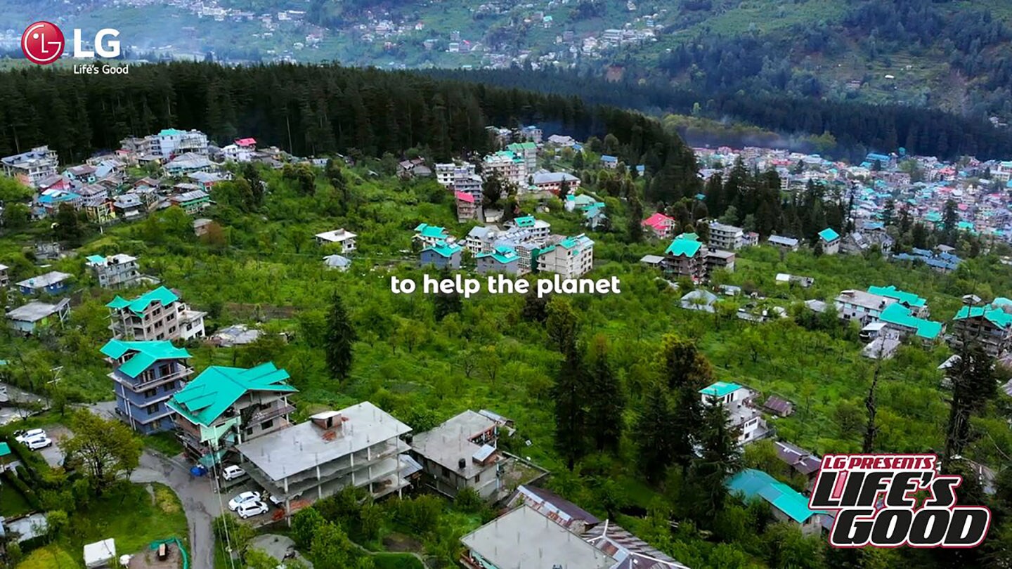 A view from LG's Life's Good video overlooking a community living in harmony with nature, with the phrase