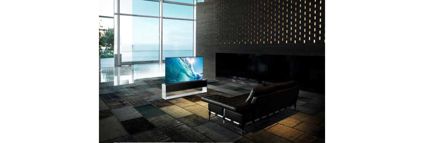 LG SIGNATURE OLED R positioned in a modern living space while vividly displaying crashing waves
