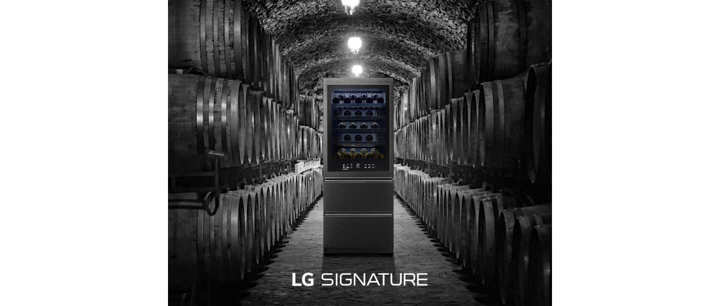 LG SIGNATURE Wine Cellar standing in the middle of a more traditional wine cellar full of wine barrels