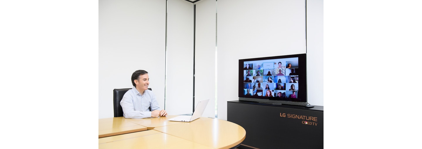 Carlos Olave, LG Global HR Leader, video chatting with LG employees from around the world.