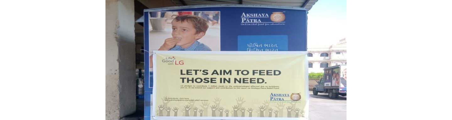 The front shot of a banner reading “Let’s Aim to Feed those in Need”