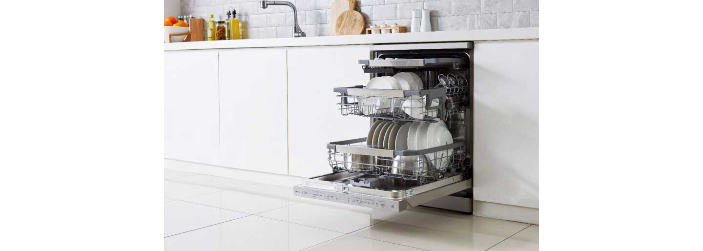 A view of a fitted LG Dishwasher with QuadWashTM the door open to show it full of clean dishes, pots and glasses